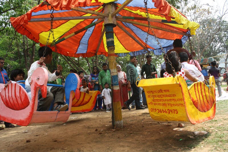 Bangladeshi children ride a merry-go-round as they celebrate the Bengali New Year or â€œPohela Boishakhâ€ in Dhaka on April 14, 2015. The Bengali calendar or .Bangla calendar is a traditional solar calendar and the year begins on Pohela Boishakh, which falls on April 14 in Bangladesh. Bangladeshi children ride a merry-go-round as they celebrate the Bengali New Year or â€œPohela Boishakhâ€ in Dhaka on April 14, 2015. The Bengali calendar or .Bangla calendar is a traditional solar calendar and the year begins on Pohela Boishakh, which falls on April 14 in Bangladesh