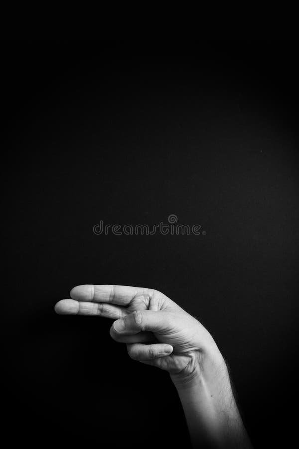 B&W image of hand demonstrating ASL sign language letter H with empty copy space stock photo