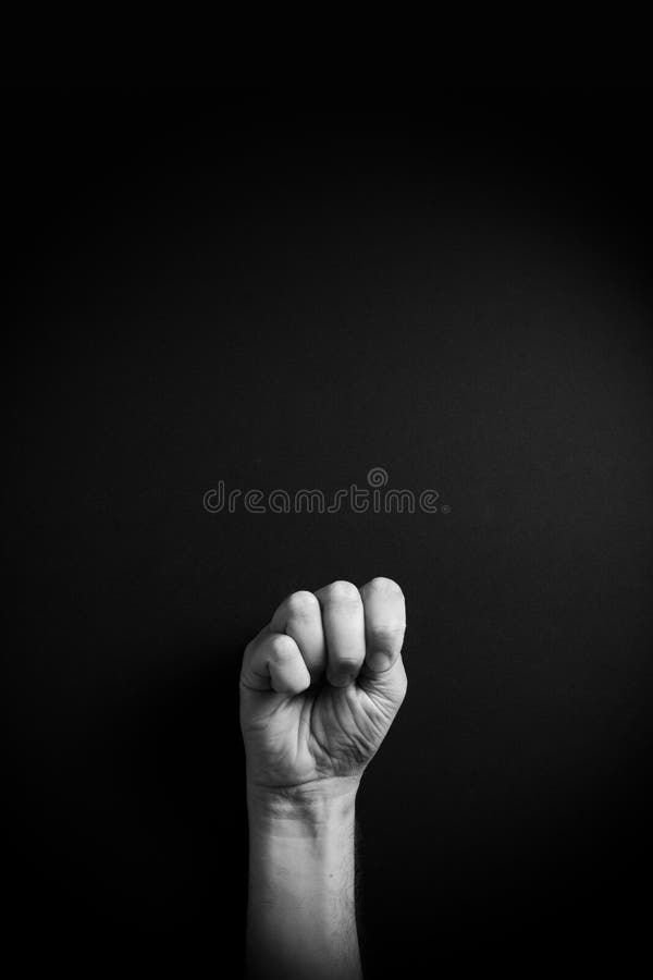 B&W image of hand demonstrating ASL sign language letter M with empty copy space royalty free stock images