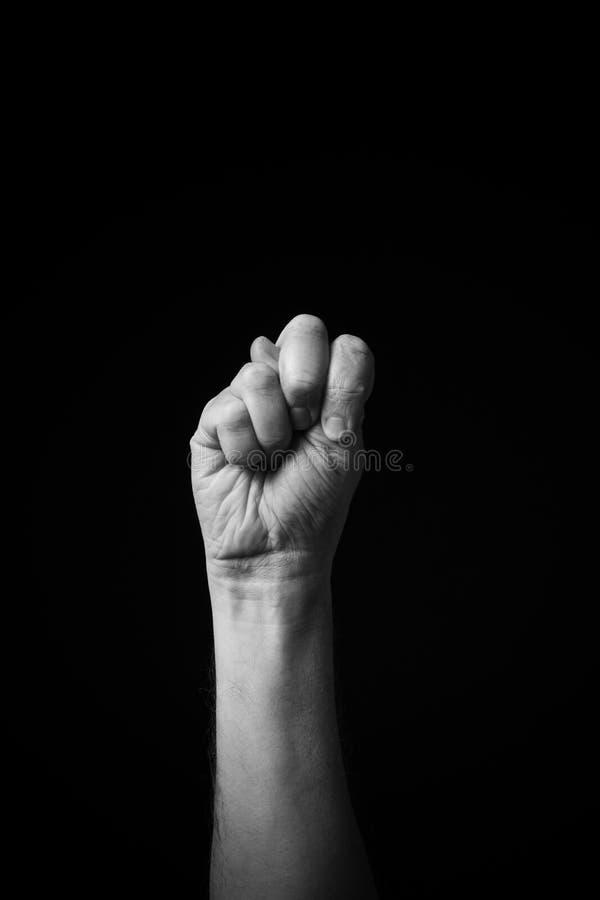 B+W image of hand demonstrating Chinese sign language letter N isolated against black background stock photo