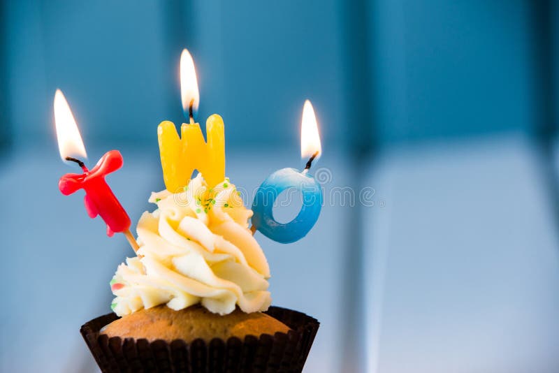 Birthday's cake - cupcake with a candles for 2 - second birthday . Happy birthday !. Birthday's cake - cupcake with a candles for 2 - second birthday . Happy birthday !