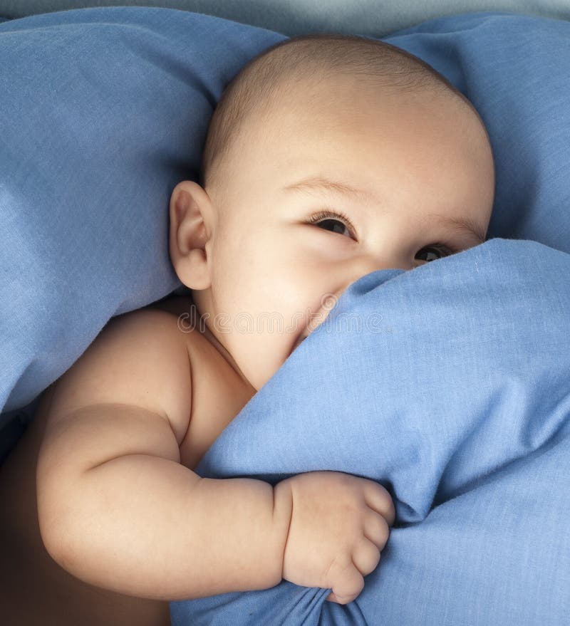 Yawning Sleeping Baby on Colorful Towels Stack Stock Photo Image of