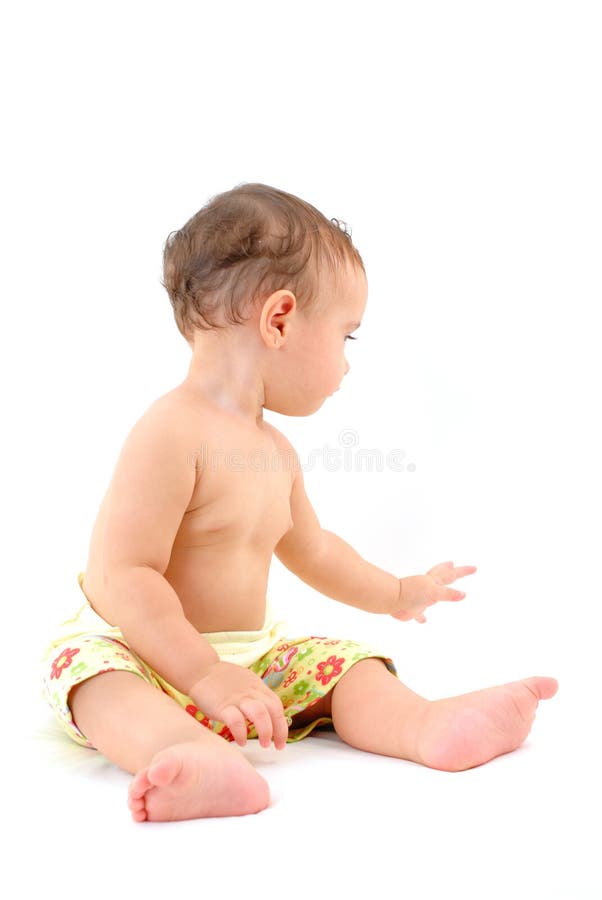 Baby is putting on pants stock photo. Image of baby, pants 12783942