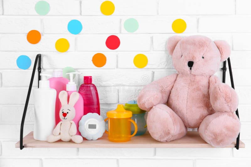 Baby Accessories on Shelf Near Brick Wall Stock Image Image of body, childhood 157749775
