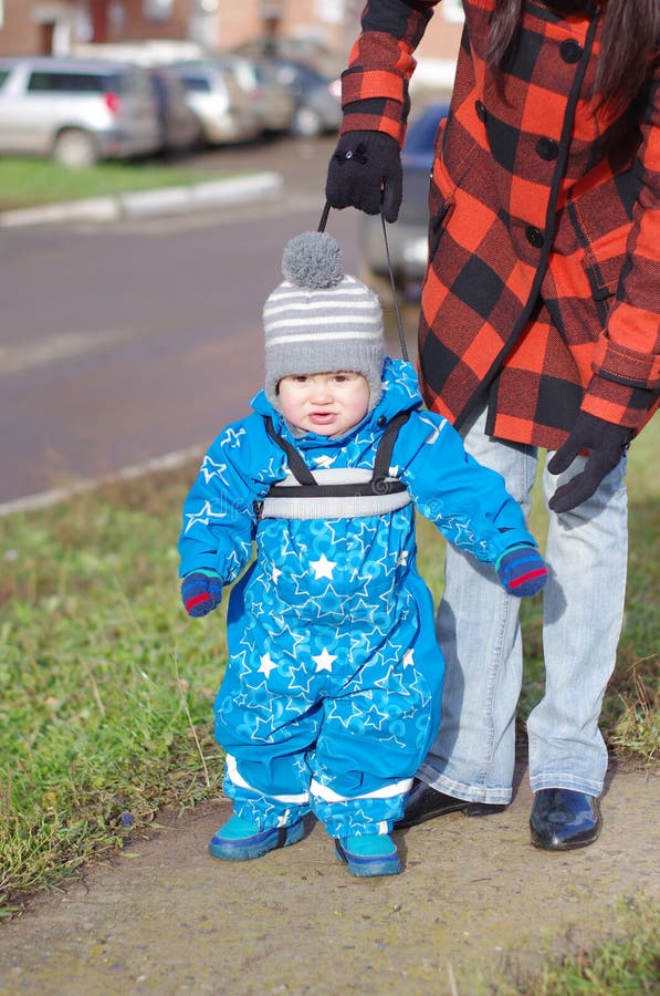 Baby Age of 1 Year Walking with Help of Leading Strings Stock Image