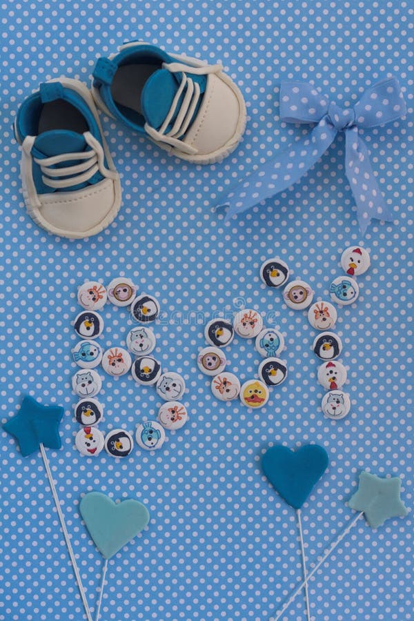 Boy sign with kids buttons on blue polka dots background. Baby announcement. Fondant accesories. Baby shower idea. Boy sign with kids buttons on blue polka dots background. Baby announcement. Fondant accesories. Baby shower idea.