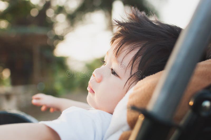 Baby Asia Boy in Stroller With eyes staring. stock photography Baby Asia Boy in Stroller With eyes staring. stock photography