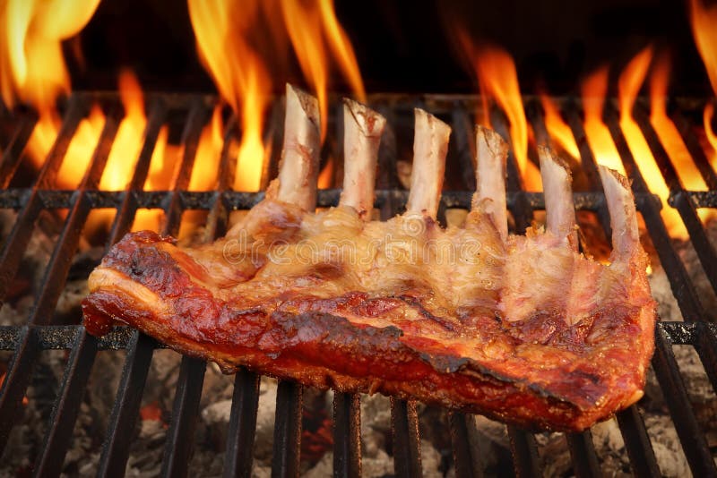 Baby Back Or Spare Ribs On The Flaming BBQ Grill