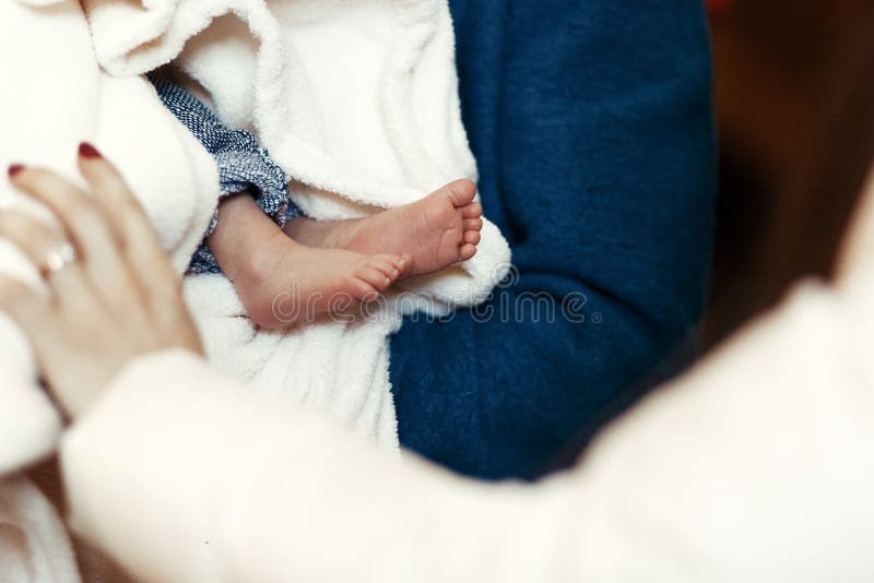 Baby baptism. cute feet of a little boy at christening ceremony