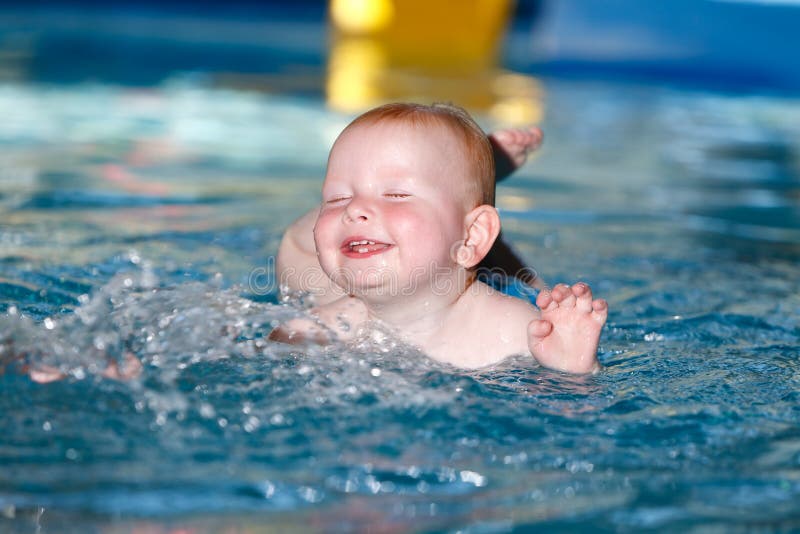 Baby bathes in a pool