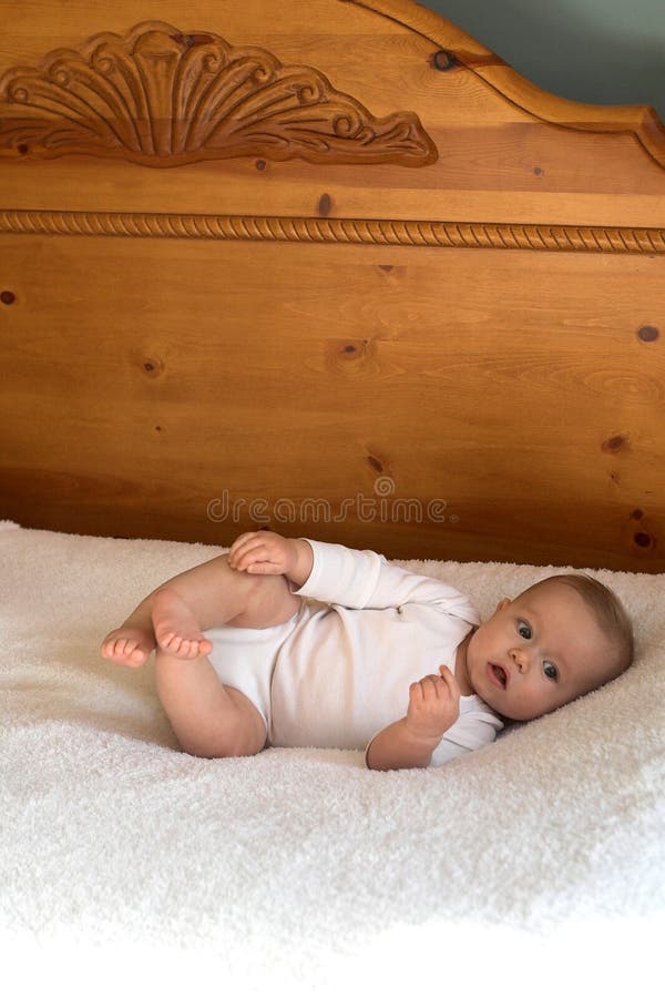 Baby on Bed stock photo. Image of clean, feet, bare, curious 1813614