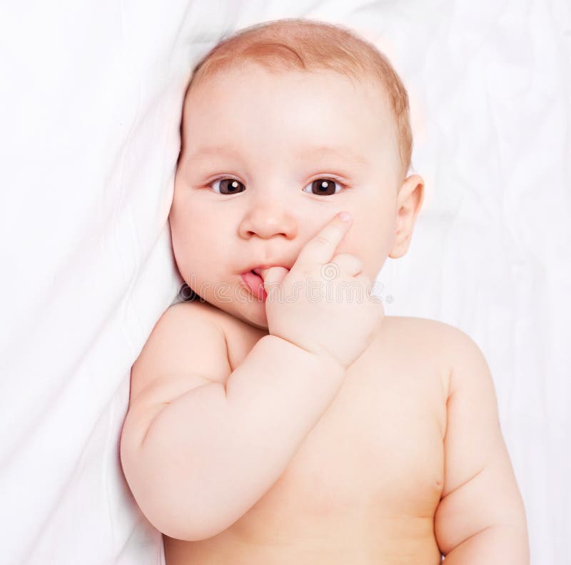 Baby on the bed stock image. Image of beautiful, cute 19257617