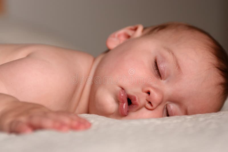 Baby on Bed stock photo. Image of dreaming, baby, infant 2622842