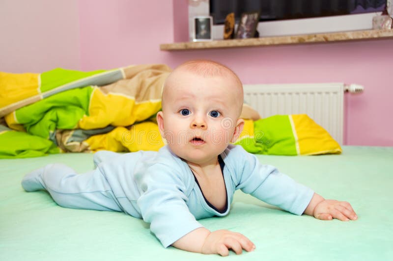 Baby on bed stock photo. Image of child, eyes, colour 8792190