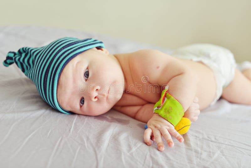 Baby on the bed royalty free stock image