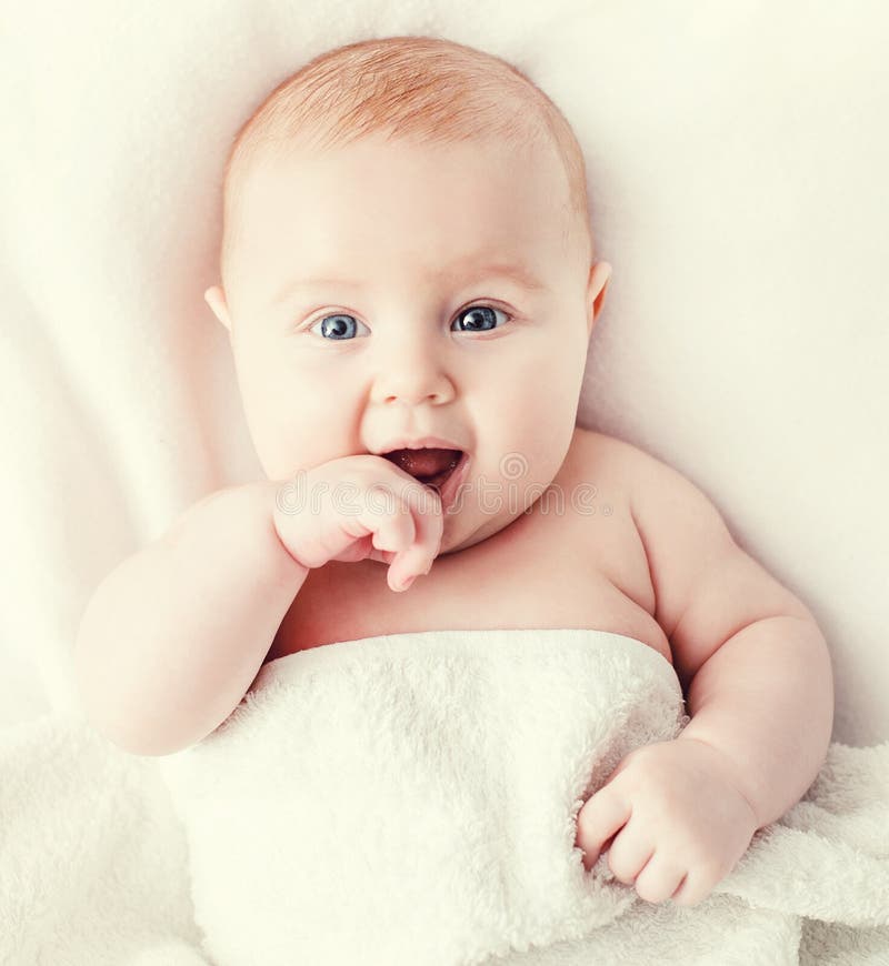 Baby on the bed stock image. Image of blue, caucasian 47624501