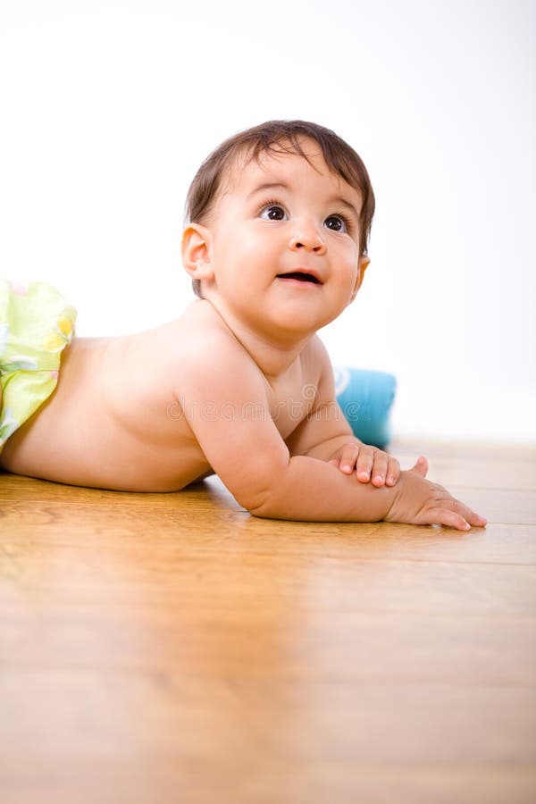 Cute 8 months old baby belly-band on hardwood floor. Lovely european female stock images, royalty-free photos and pictures