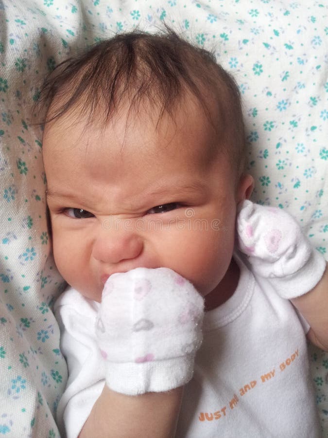 Baby Biting His Fist and Makes a Face Stock Image Image of portrait