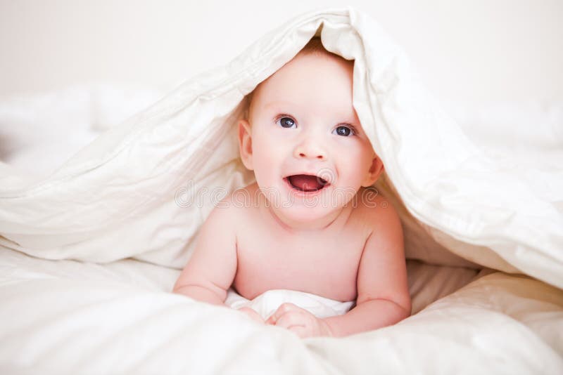 Baby in a Blanket stock image. Image of laying, excited 57916617
