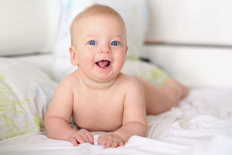 Baby boy with blue eyes stock photo. Image of happiness 77396110