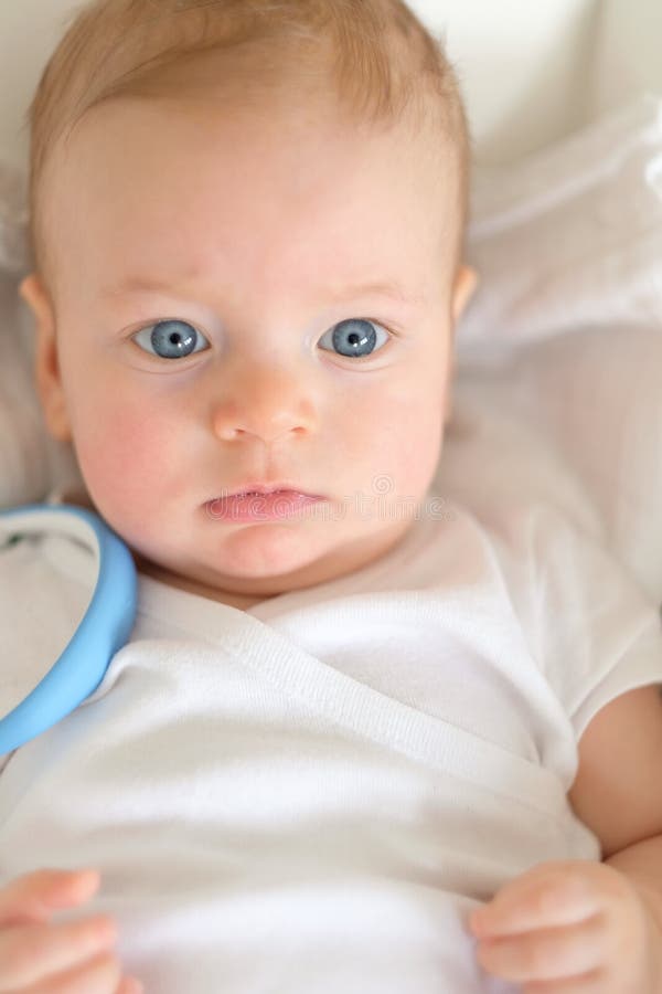 Baby boy with blue eyes stock photo. Image of human, offspring 91911196