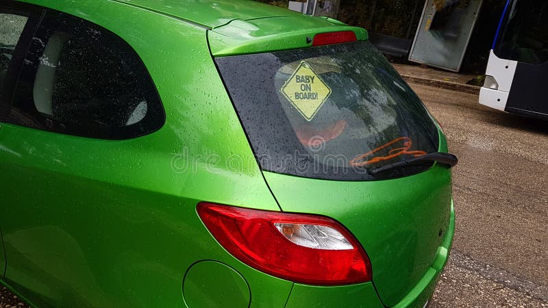 Baby on board on the rear window of the car , safety royalty free stock images Baby on board on the rear window of the car , safety royalty free stock images