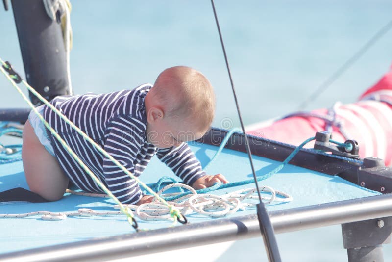 Baby on board of sea yacht