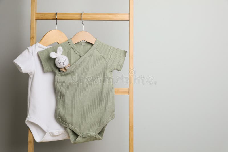 Hangers with Baby Clothes in Wardrobe Stock Image - Image of keeping,  hangers: 132765883