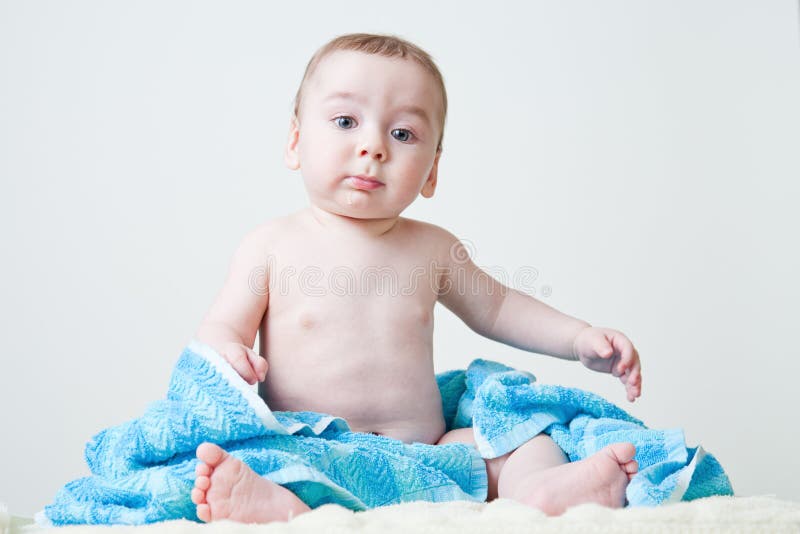 Baby Boy After Bath Sitting on Blue Towel stock images Baby Boy After Bath Sitting on Blue Towel stock images