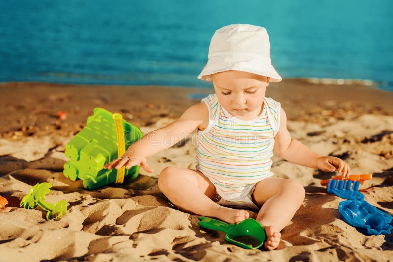 Baby boy on the beach stock photo. Image of caucasian 76304206