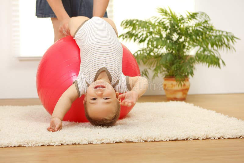 Baby boy on big ball stock photo. Image of playing, ball 15398740