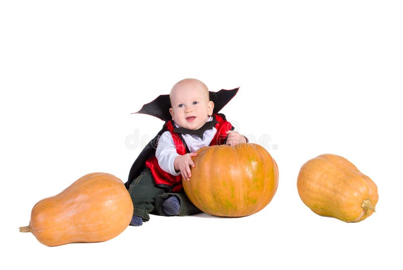 Baby boy in black halloween cloak with hat