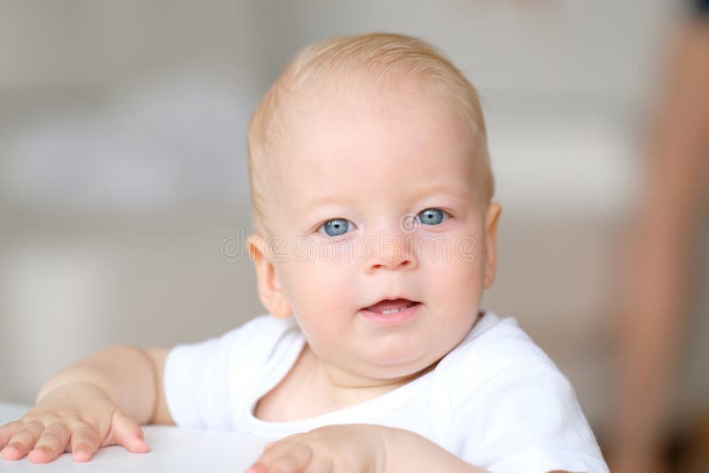 Baby boy with blue eyes stock photo. Image of childhood 84954346