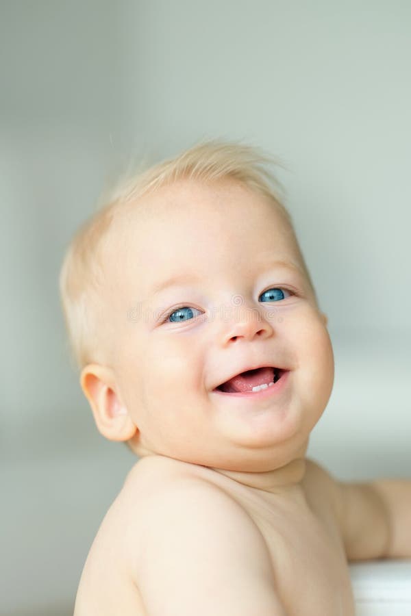 Baby boy with blue eyes stock image. Image of portrait 84960519