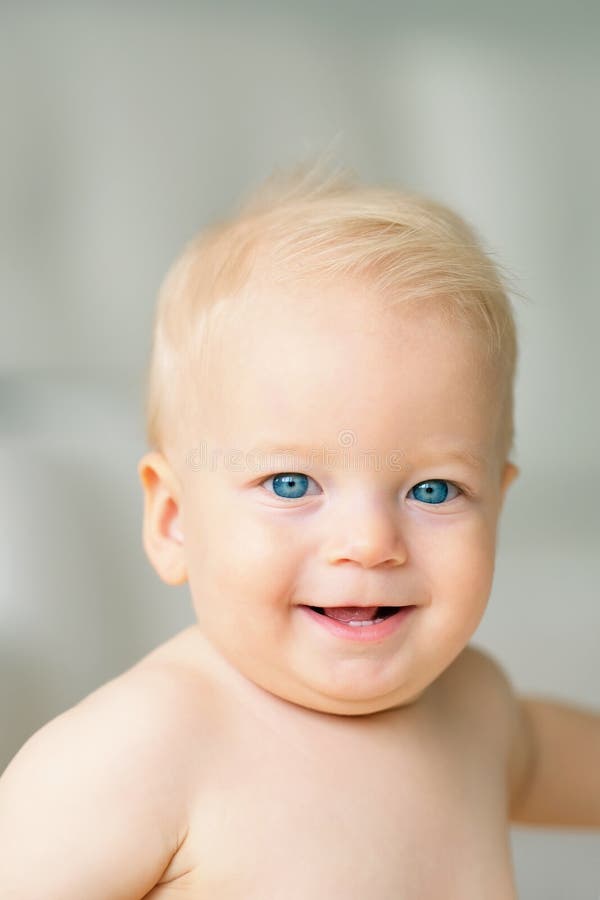 Baby boy with blue eyes stock image. Image of indoor 87202575