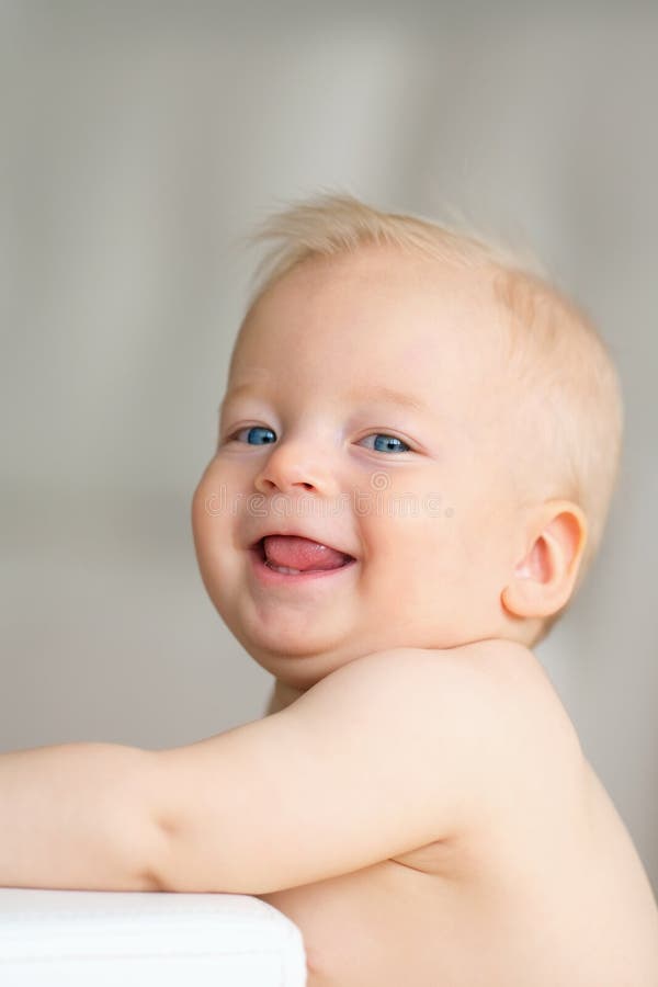 Baby boy with blue eyes stock photo. Image of indoor 91047850