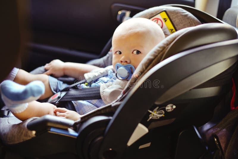 Baby boy in the car royalty free stock images