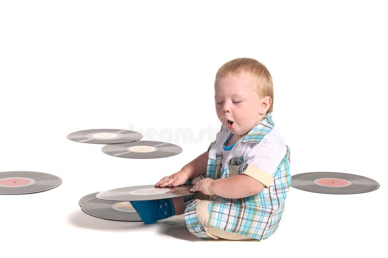 Baby boy DJ playing with vynil disks