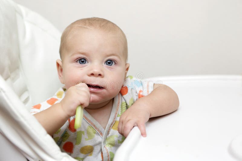 Baby eating with spoon stock image. Image of face, meal 24010145