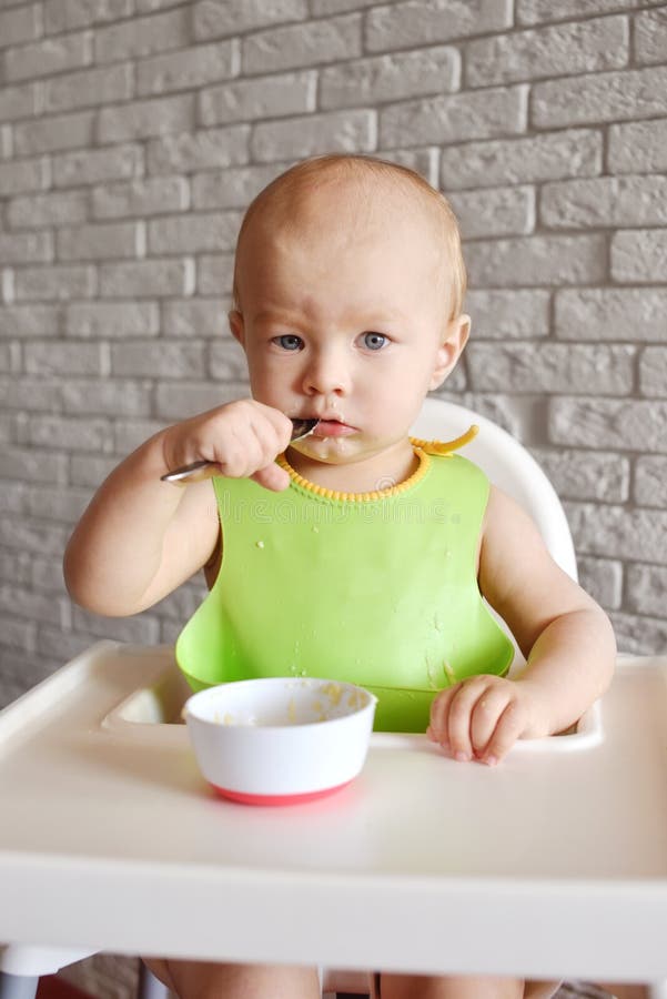Baby boy eating stock photo. Image of cheerful, little 133673408