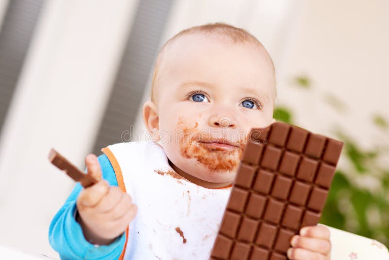 Baby Boy Eating Chocolate Stock Photo. Image Of Child - 76892648