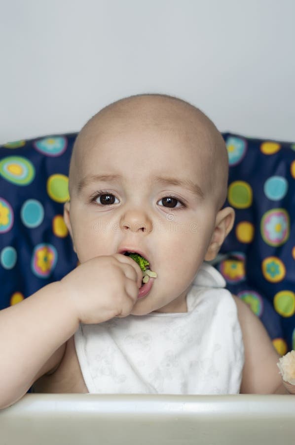 Baby boy eating vegetables stock photo. Image of food 38009300