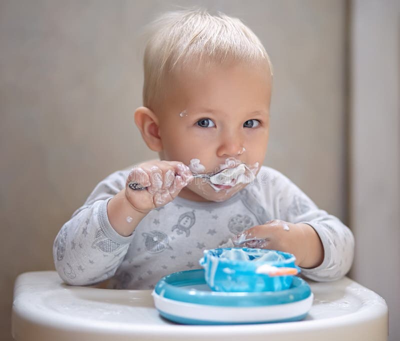 Baby Boy Eating Yogurt