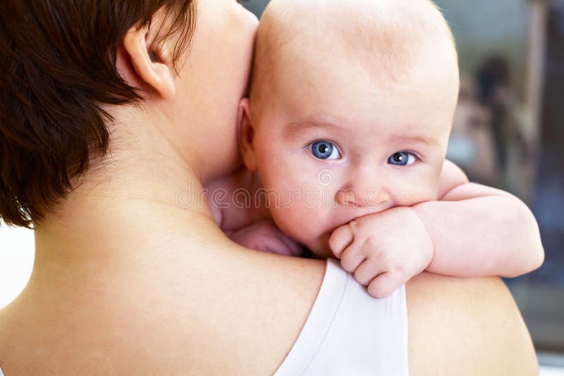 Baby boy with hand in mouth