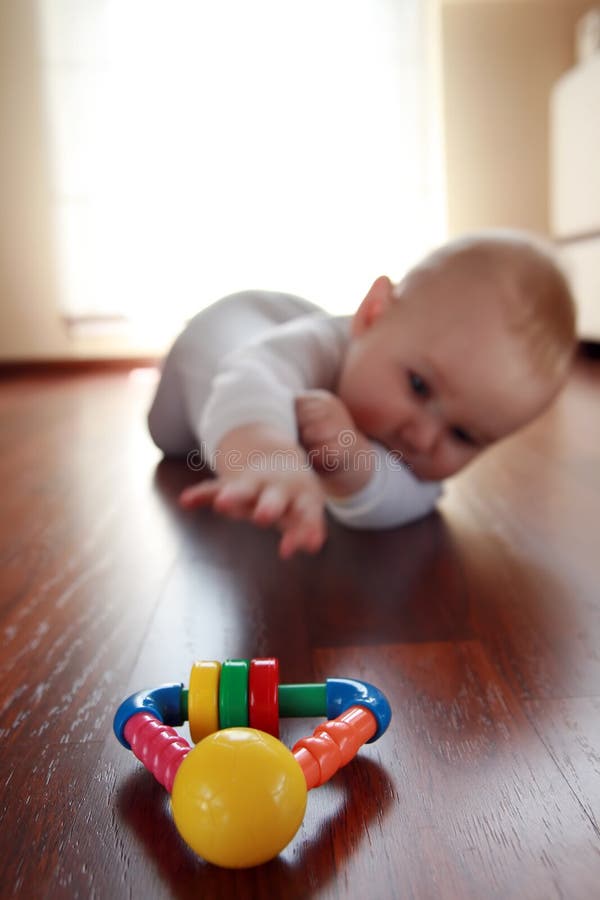 Baby boy with his first toys