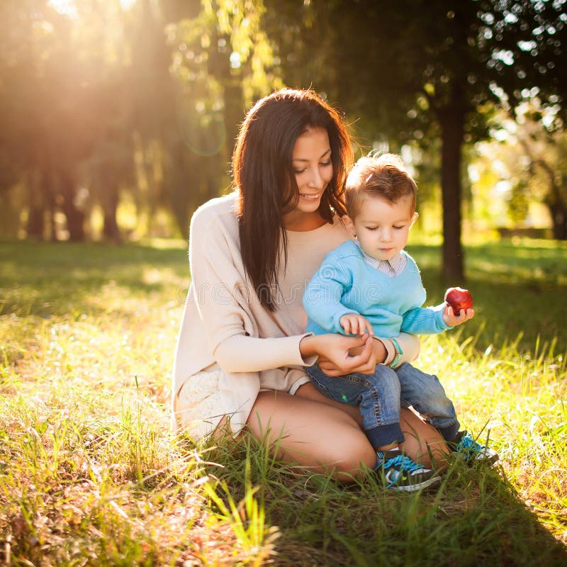 Baby boy in the park with his mum