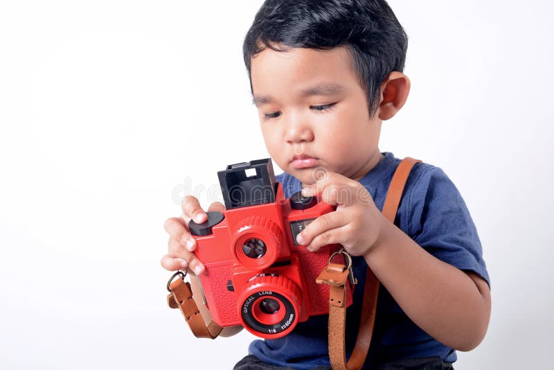 Baby boy holding camera stock photo. Image of camera - 39873492
