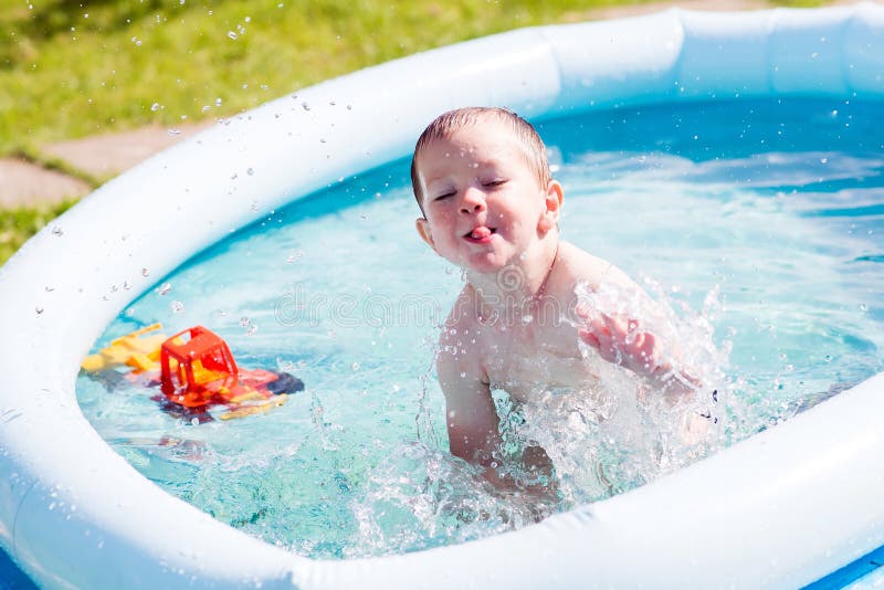Baby Boy in a Home Swimming Pool. Joy, Fun Stock Photo Image of relax