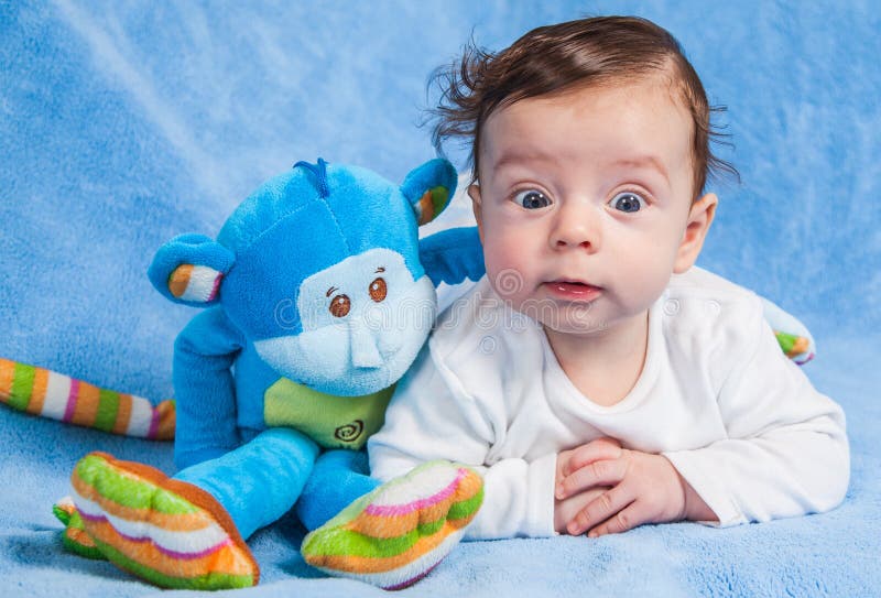 Baby boy with monkey stock photo. Image of months, sweet 57410616