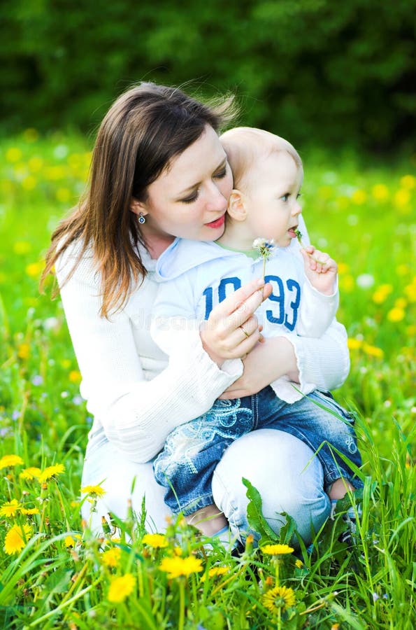 Baby boy with mother play in park